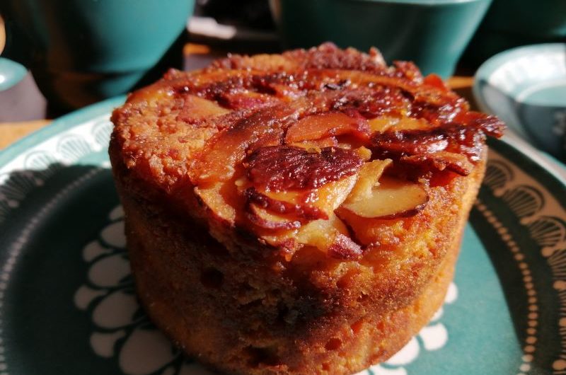 Orange Almond Cake with Ricotta A small round golden cake with baked in orange and almond on top